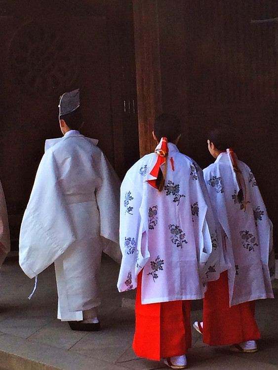 Shinto Priest and Female Shrine Stewards at Meiji Shrine